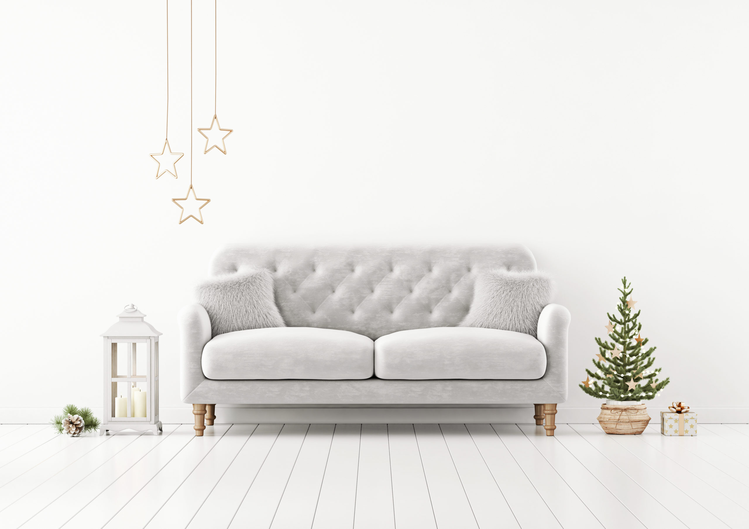 Living room interior wall mock up with grey tufted sofa, fur pillows, lantern and decorated christmas tree on empty white background. 3D rendering. Sonae Arauco interior wall mock